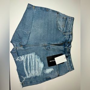 light blue washed distressed denim mom shorts